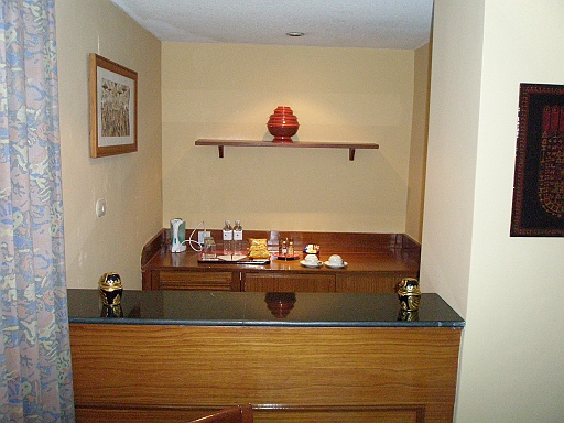 P1090160.JPG - The Mandalay Hill Resort. Our room with a bar/kitchenette corner.