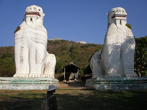 P1090173.JPG - The begin of the staircase to the Mandalay Hill. At the top of the hill is the Sutaungpyei (literally wish-fulfilling) Pagoda. A panoramic view of Mandalay from the top of Mandalay Hill alone makes it worthwhile to attempt a climb up its stairways. There are four covered stairways called saungdan leading up the hill from the south, southeast, west and north, and convenient seats of masonry work line these stairways all the way up.